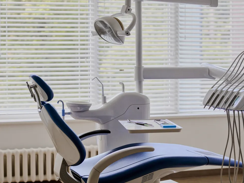 A bright, empty dental operatory ready for the next patient.